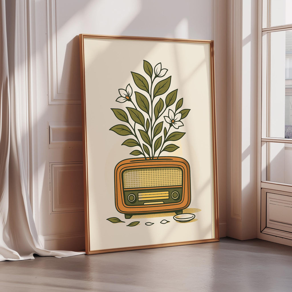 A framed illustration of a radio with a plant growing out of it, placed on a wooden floor against a white wall.