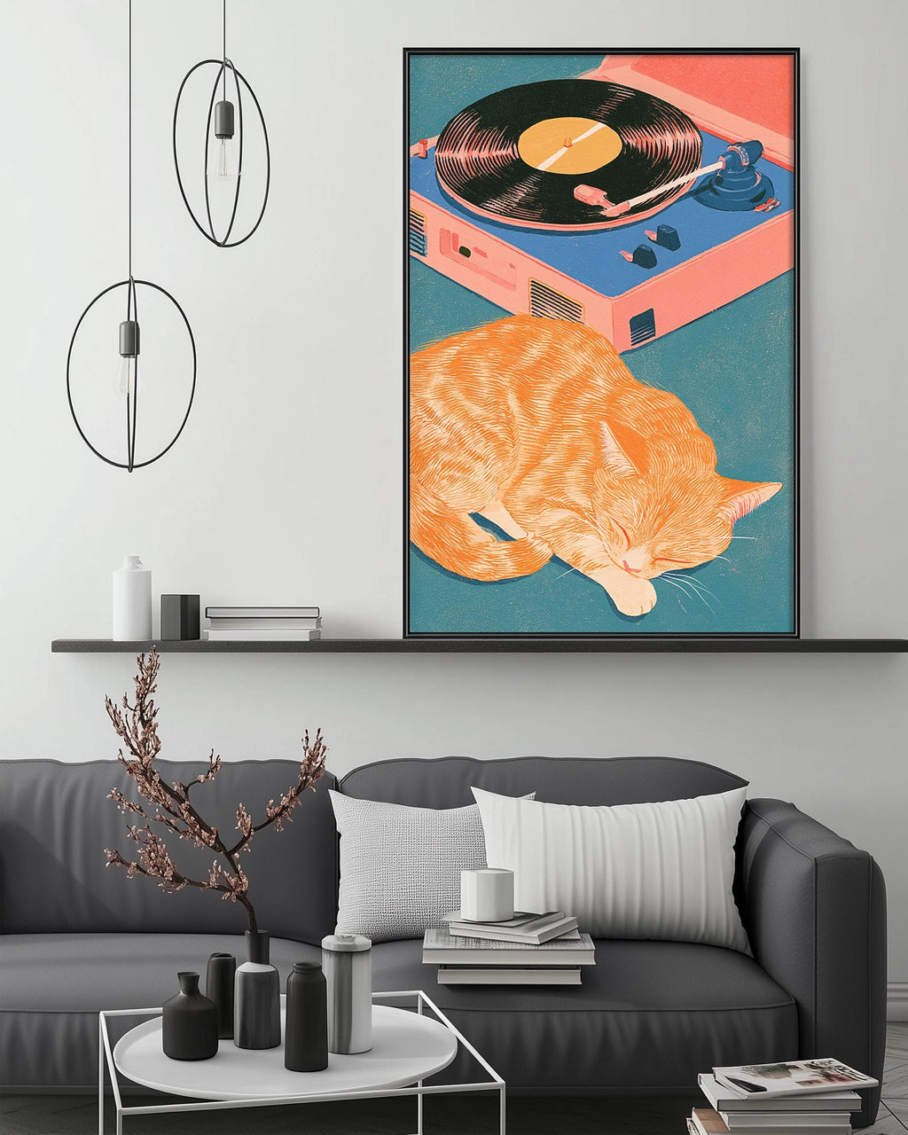 a cozy living room with a gray sofa, a coffee table, and a framed illustration of a sleeping orange cat on a record player.