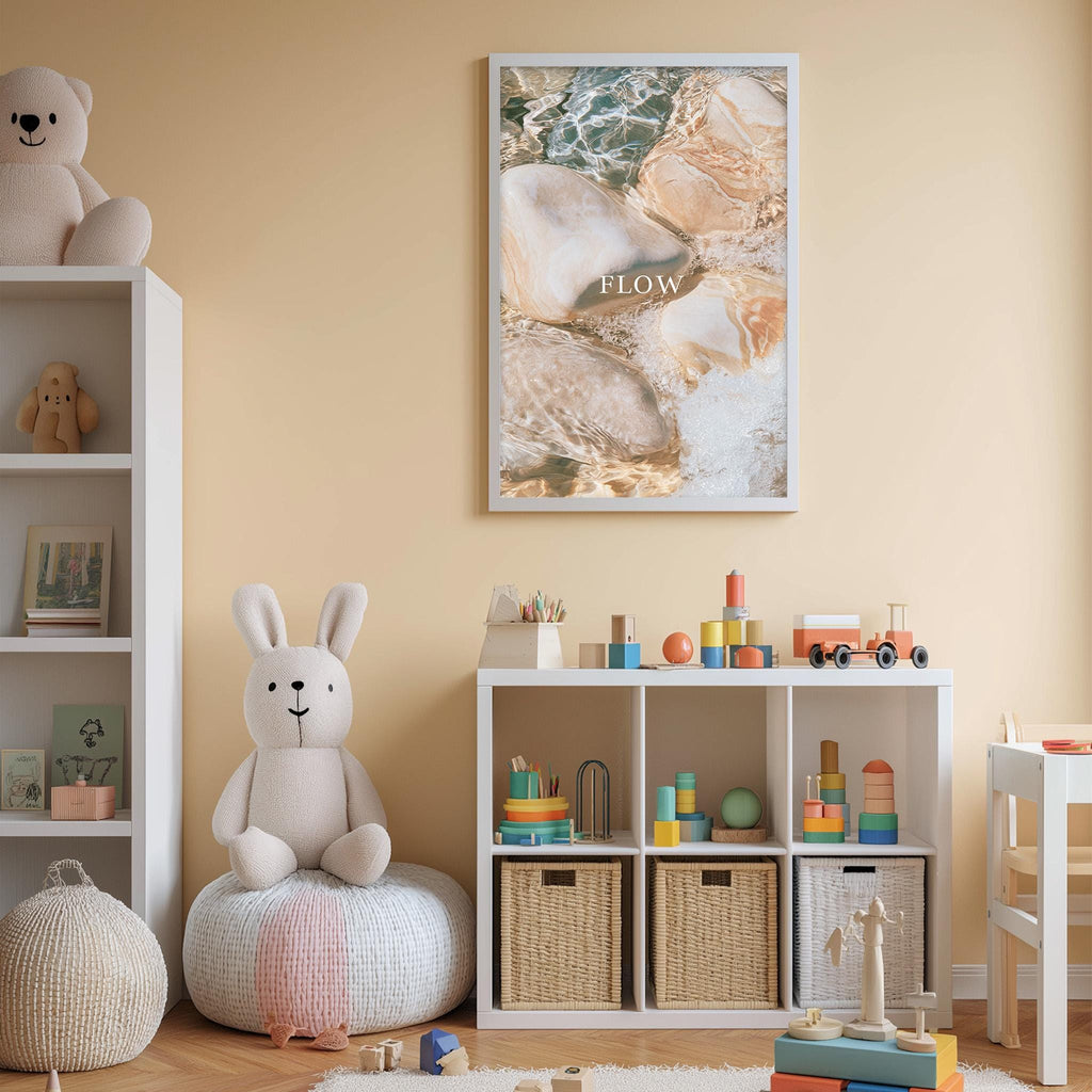 A cozy and colorful children's bedroom with a white bookshelf, a plush rabbit, and a toy train set. The walls are painted a light peach color, and there is a framed poster with the word "FLOW" on the wall.