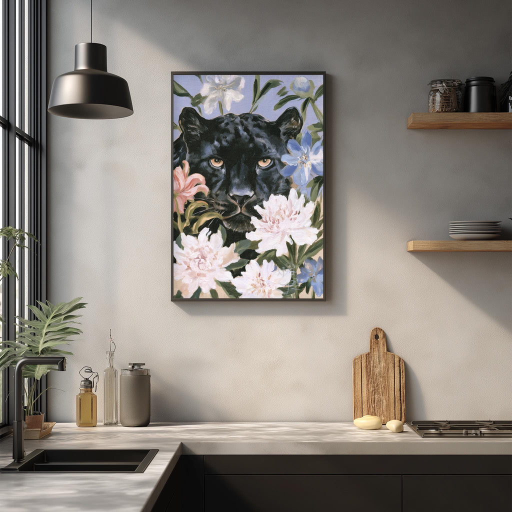 a framed painting of a black panther surrounded by flowers on a wall in a kitchen setting.