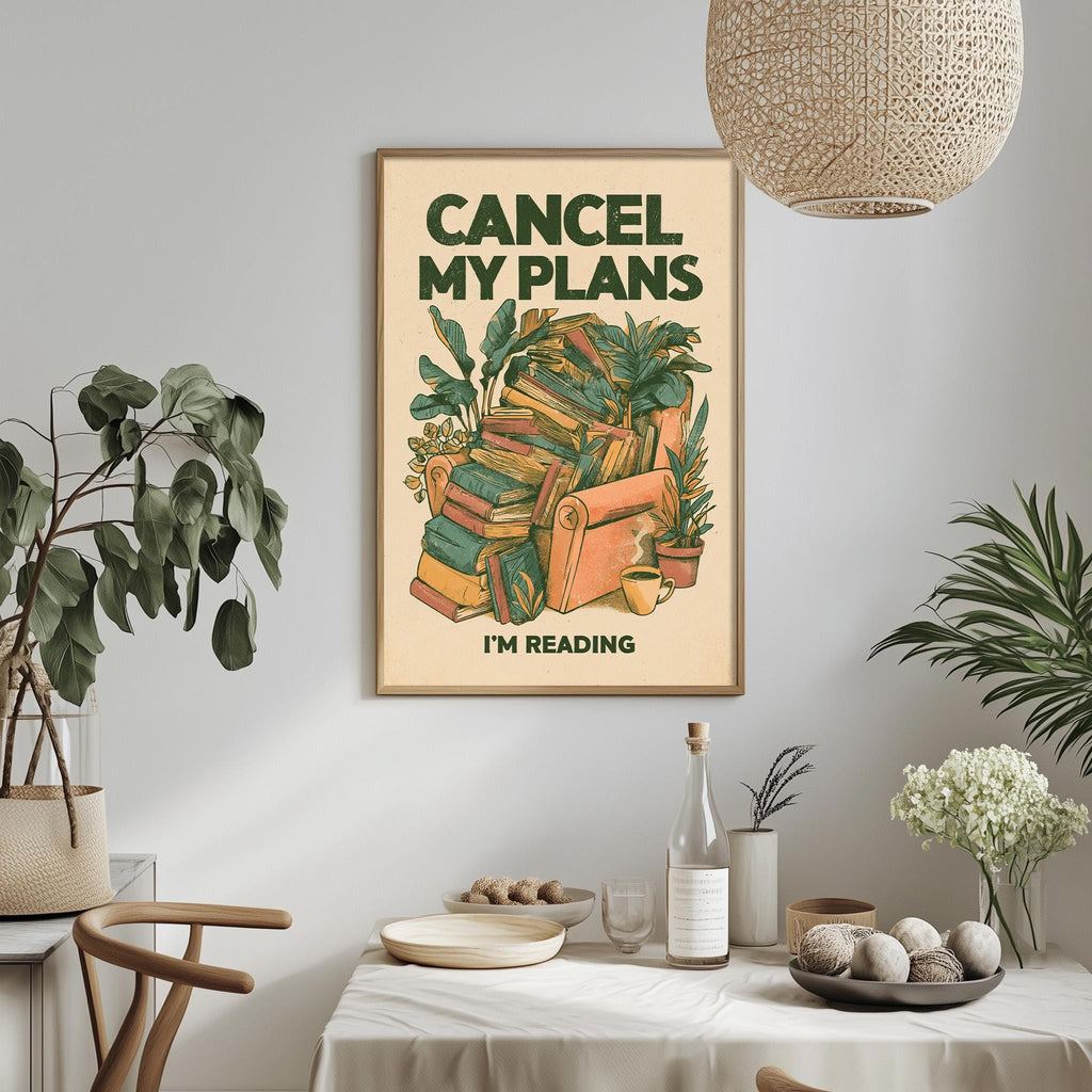 a framed poster with the text "CANCEL MY PLANES I'M READING" hanging on a wall above a dining table with various items on it.