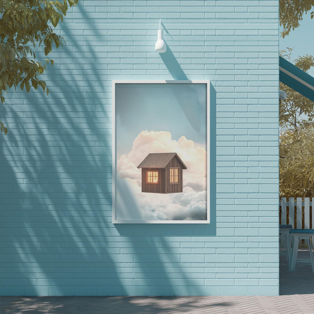 a blue brick wall with a framed picture of a small wooden cabin on the wall, set against a backdrop of a cloudy sky.