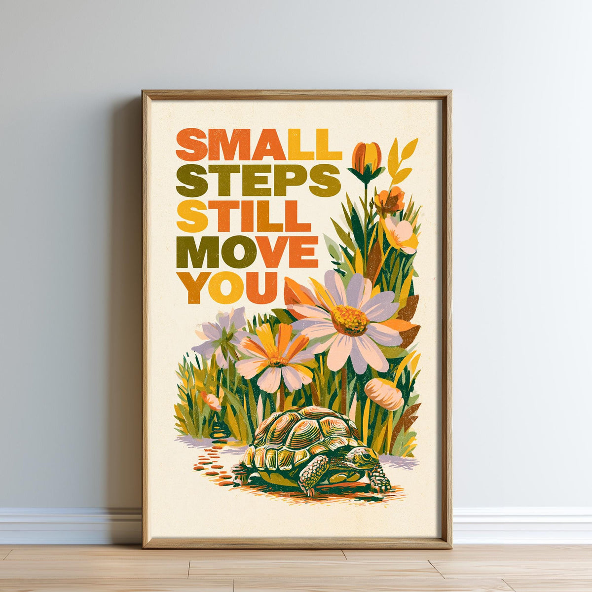 The image is a framed poster with a turtle and flowers, featuring the text "Small steps still move you" in a colorful, artistic style.