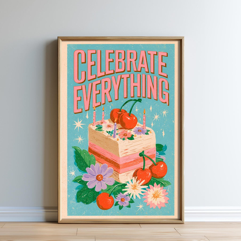 The image is a framed poster with a colorful illustration of a birthday cake surrounded by flowers and cherries. The text on the poster reads "CELEBRATE EVERYTHING".