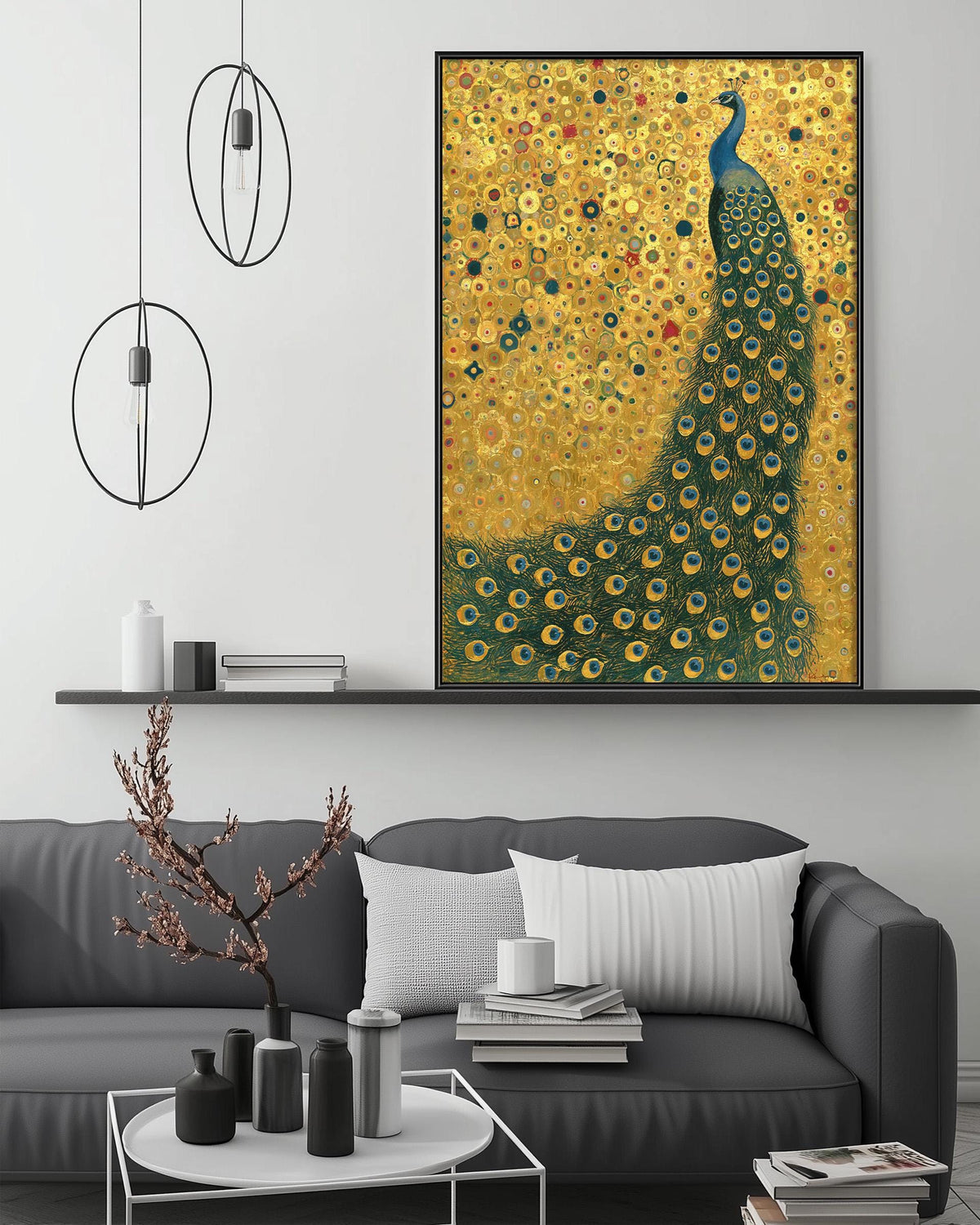 a large painting of a peacock with a yellow and green background, and the peacock is depicted in a standing position with its tail spread out. The painting is hanging on a wall above a gray couch, which has a white pillow on it. There are also some decorative items on the couch, such as a small tree branch and a stack of books.