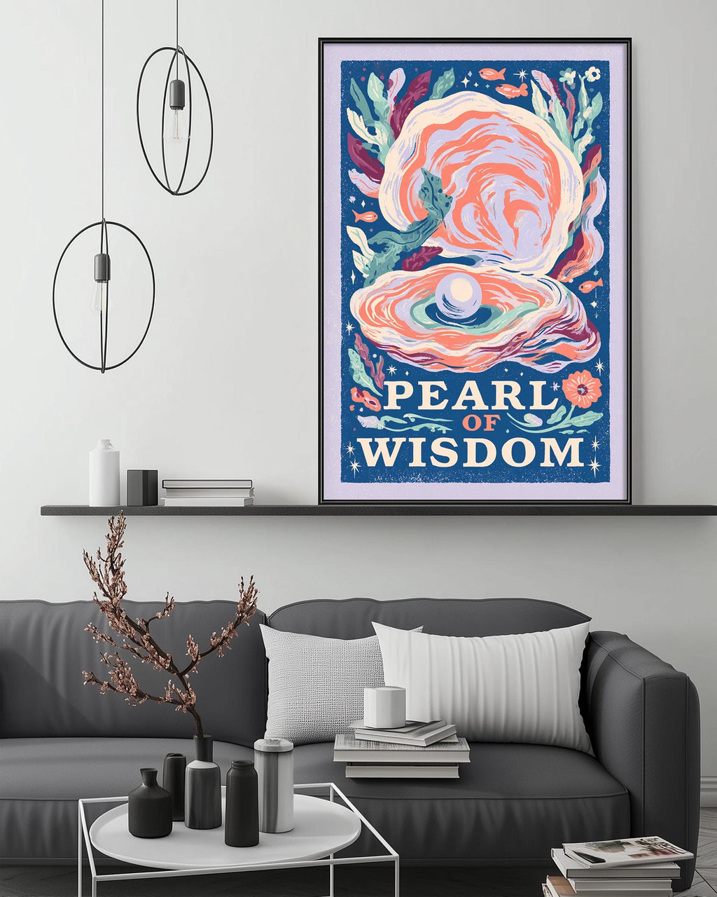 a large framed poster of a pearl of wisdom hanging on a wall above a gray couch with a coffee table in front of it.