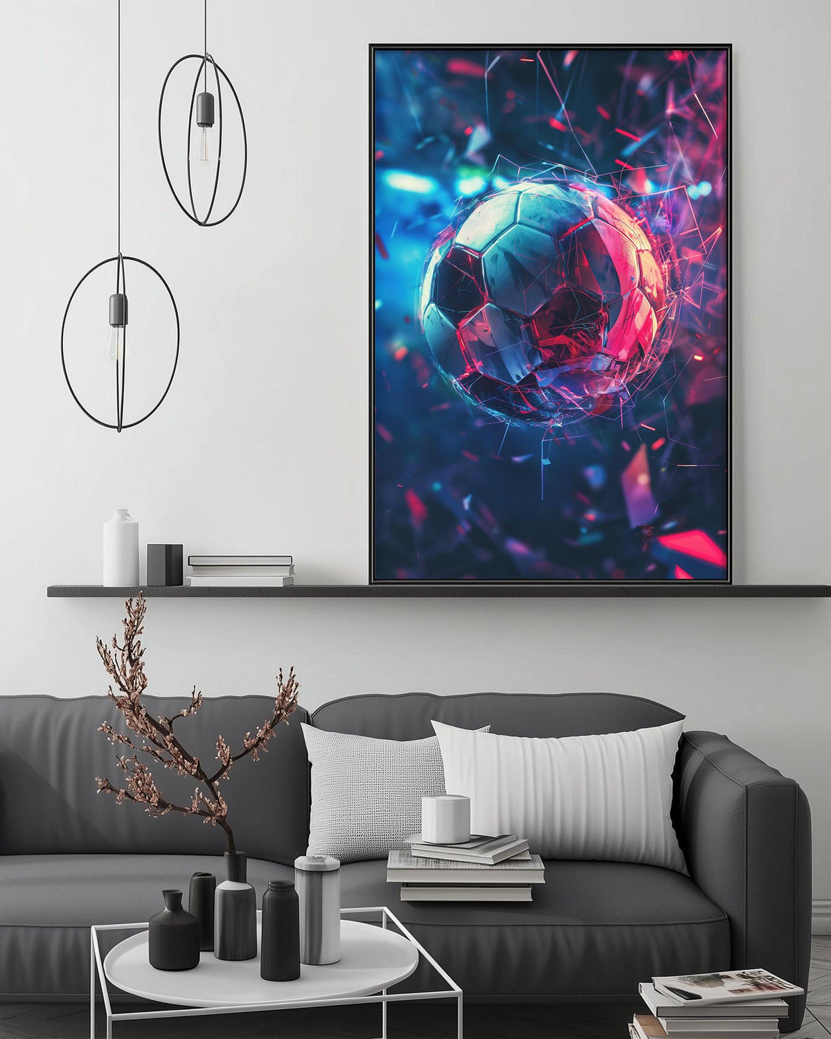 a modern living room with a gray sofa, a coffee table, and a large abstract painting of a soccer ball on the wall.