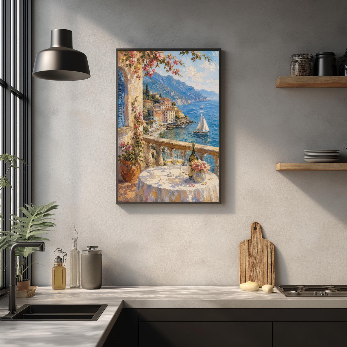 a kitchen with a framed painting of a coastal town with a sailboat on the water, hanging on the wall above a countertop with various kitchen items and decor.