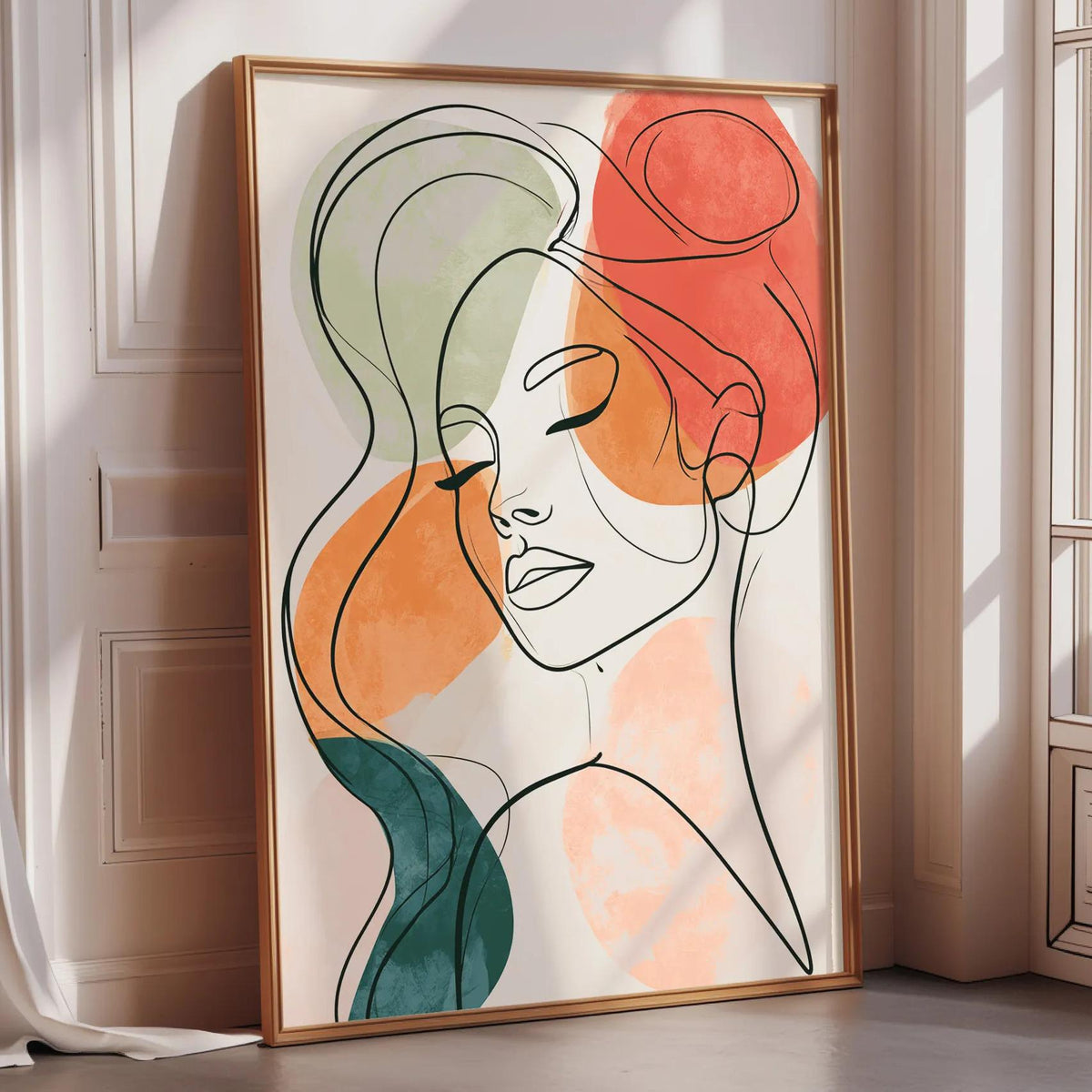 a framed abstract portrait of a woman with her eyes closed, set against a white background.