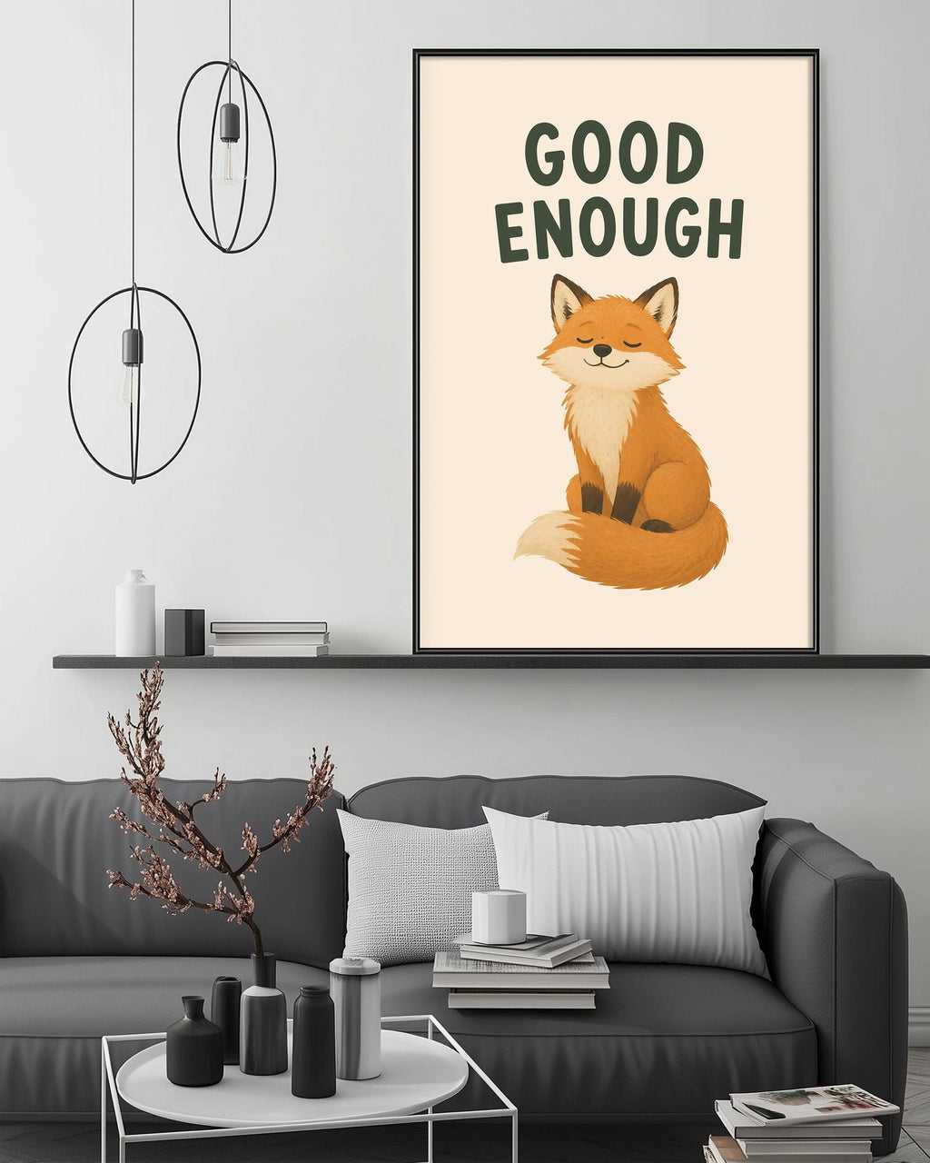 a cozy living room with a gray couch, a coffee table, and a framed poster of a cartoon fox with the text "GOOD ENOUGH" above it.