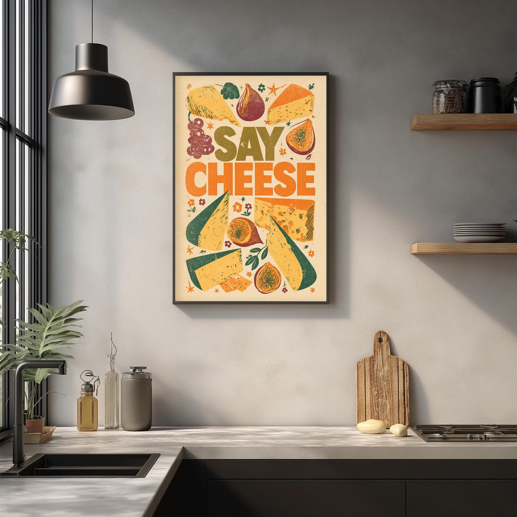 a kitchen counter with various kitchen items, such as a cutting board, a sink, and a potted plant. Above the counter, there is a framed poster with the text "Say Cheese" and an illustration of different types of cheese.