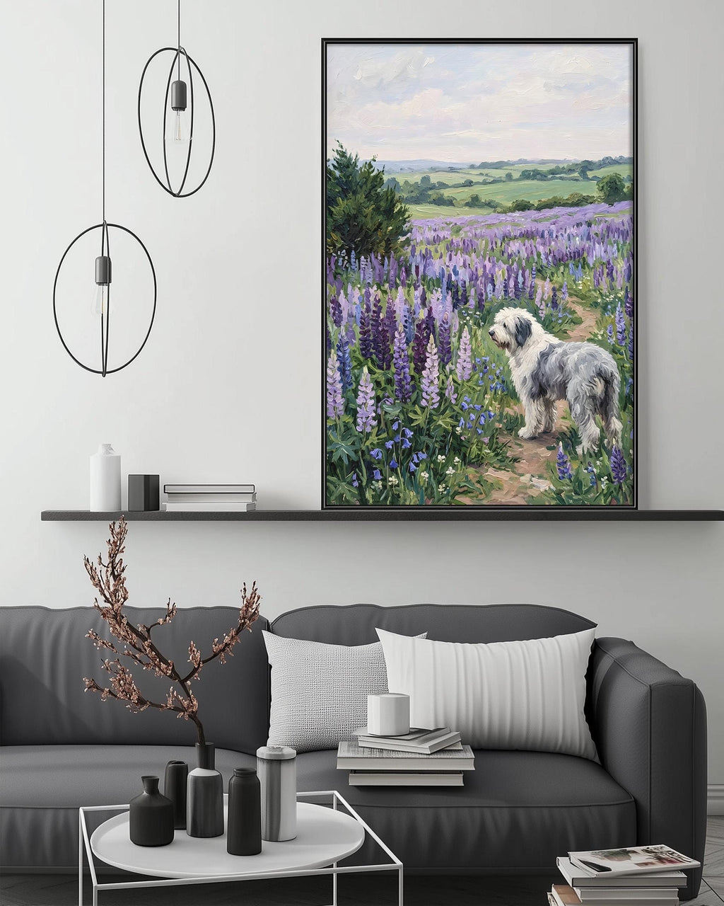 a large painting of a dog in a field of purple flowers, hanging on a wall above a gray couch with a coffee table in front of it.