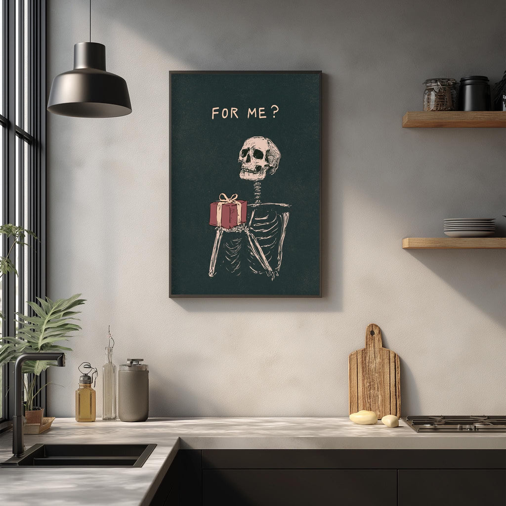 a kitchen counter with various items, including a potted plant, a cutting board, and a sink. Above the counter, there is a framed poster with a skeleton holding a gift, accompanied by the text "FOR ME?"