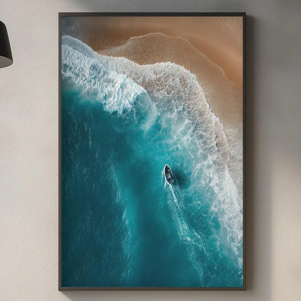 a kitchen counter with a framed picture of a surfer riding a wave, a wooden cutting board, and various kitchen items such as a bottle, a vase, and a bowl.