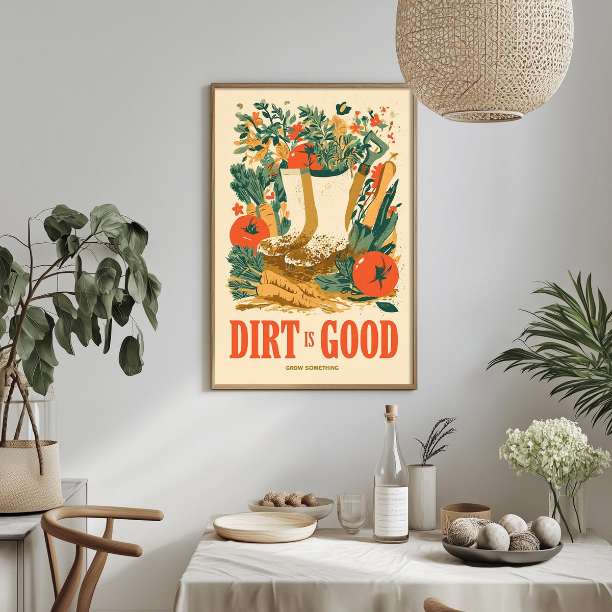 a framed poster with a vibrant illustration of a garden scene, including a pair of boots, a watering can, and various plants and flowers. The poster is hung on a wall above a dining table, which has a vase of flowers, a bottle, and a bowl of fruit on it. The table is set with plates, a fork, and a knife, suggesting a meal is about to be enjoyed. The overall scene conveys a sense of freshness and natural beauty, with the poster serving as a decorative element in the room.