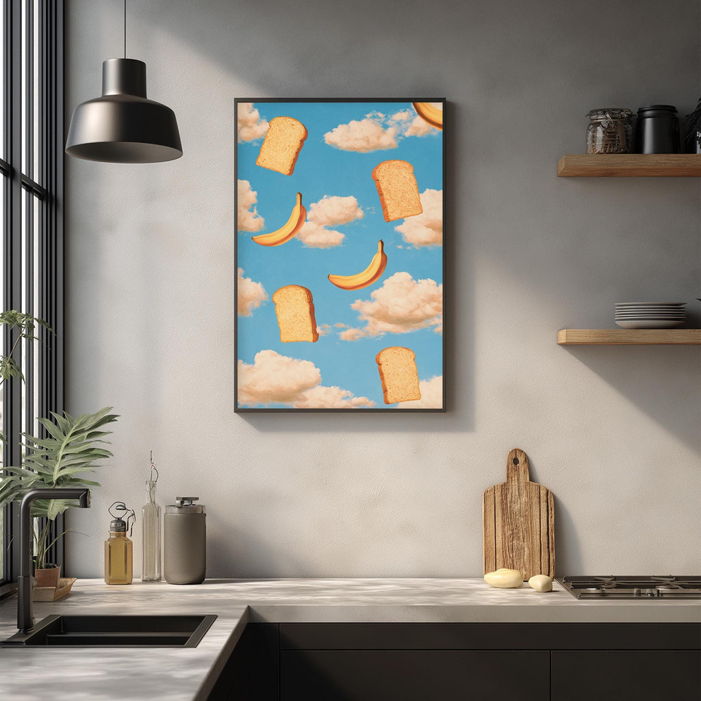 a kitchen counter with various kitchen items, including a cutting board, a sink, and a potted plant. Above the counter, there is a framed print depicting slices of bread floating in the sky against a blue background with fluffy clouds.