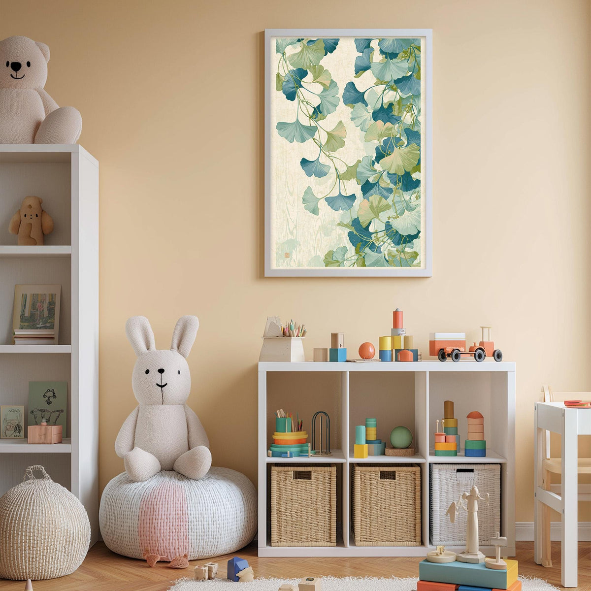 A cozy and colorful children's bedroom with a large stuffed rabbit, a bookshelf, and a toy chest filled with toys. The walls are painted a light peach color, and a framed print of a green plant with white flowers hangs above the bookshelf.