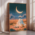 The image is a framed painting depicting a desert landscape with a crescent moon, mountains, and a ghostly figure sitting on a rock.