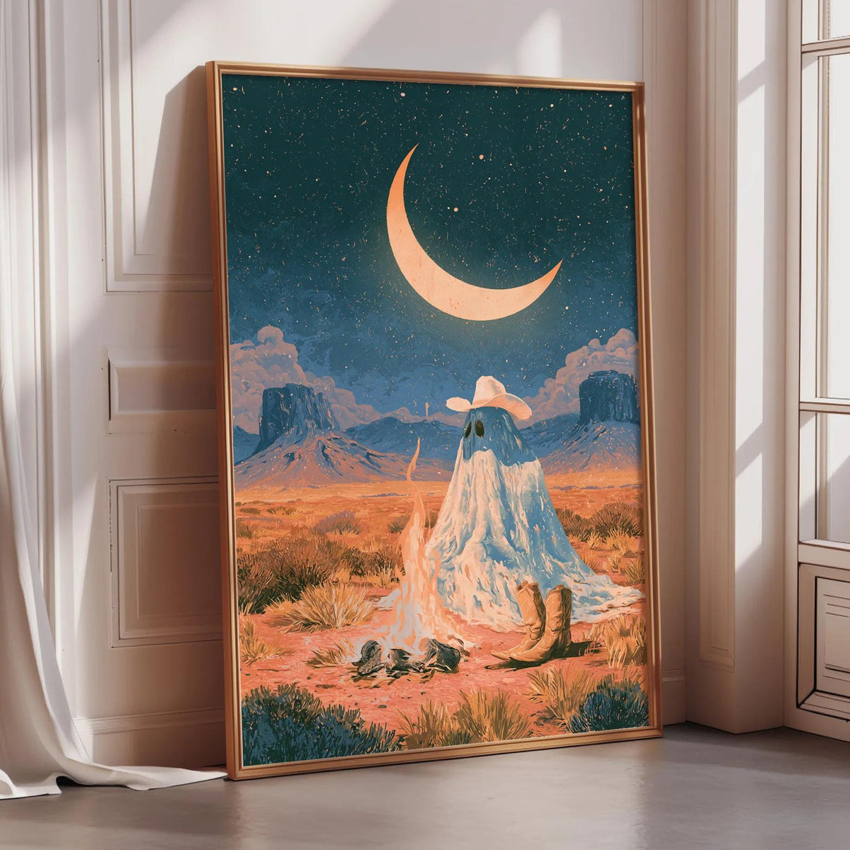 The image is a framed painting depicting a desert landscape with a crescent moon, mountains, and a ghostly figure sitting on a rock.