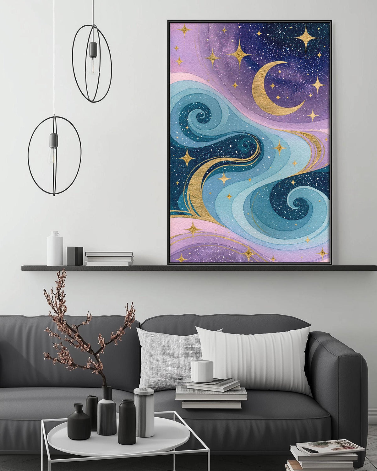 a large, colorful painting of a starry night sky with swirling clouds and crescent moons, hanging on a wall above a gray couch with white pillows. The painting is framed in black and is the focal point of the room.
