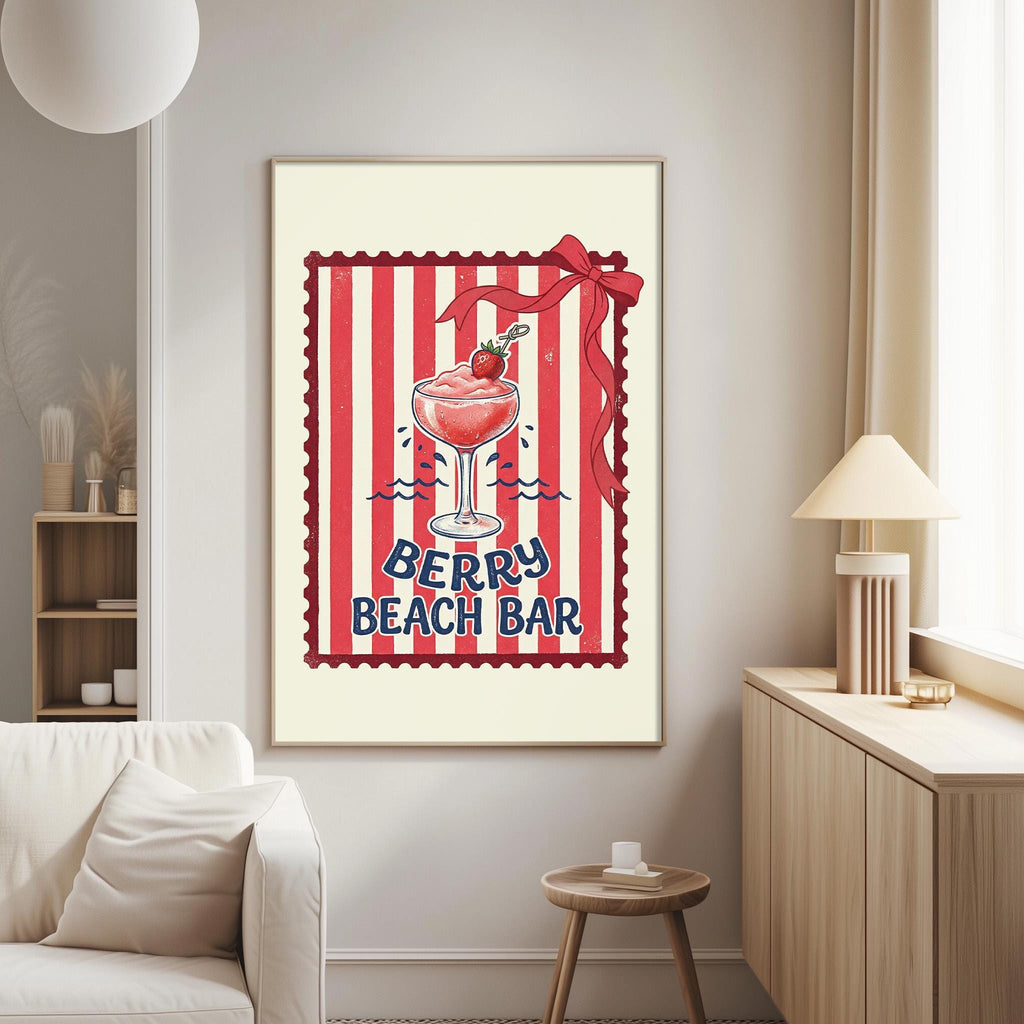 a framed poster of a berry beach bar with a red and white striped border and a bow on top of a glass filled with a red drink.