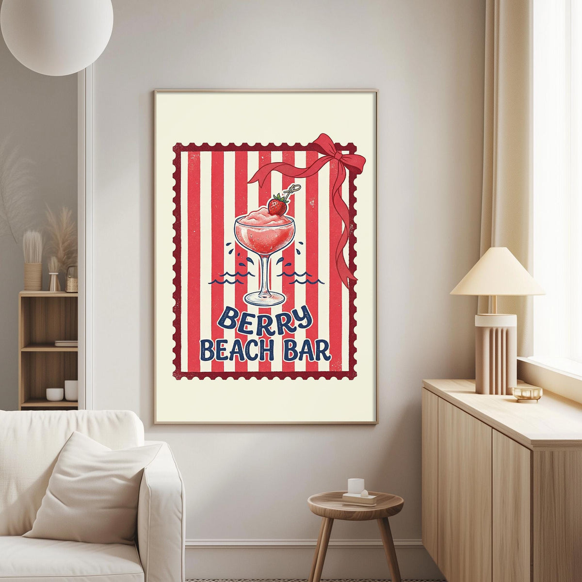a framed poster of a berry beach bar with a red and white striped border and a bow on top of a glass filled with a red drink.