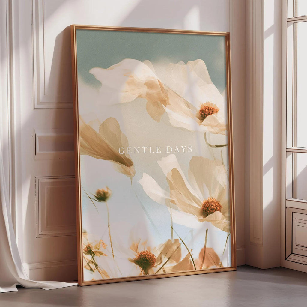 a large framed poster with a floral design, placed on a wooden floor next to a window.