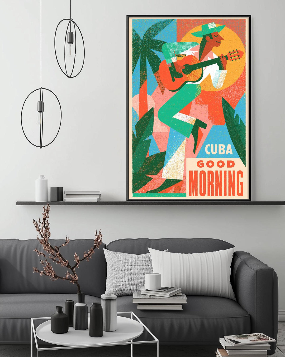 a modern living room with a gray sofa, a coffee table, and a large framed poster of a man playing a guitar and singing above the sofa.