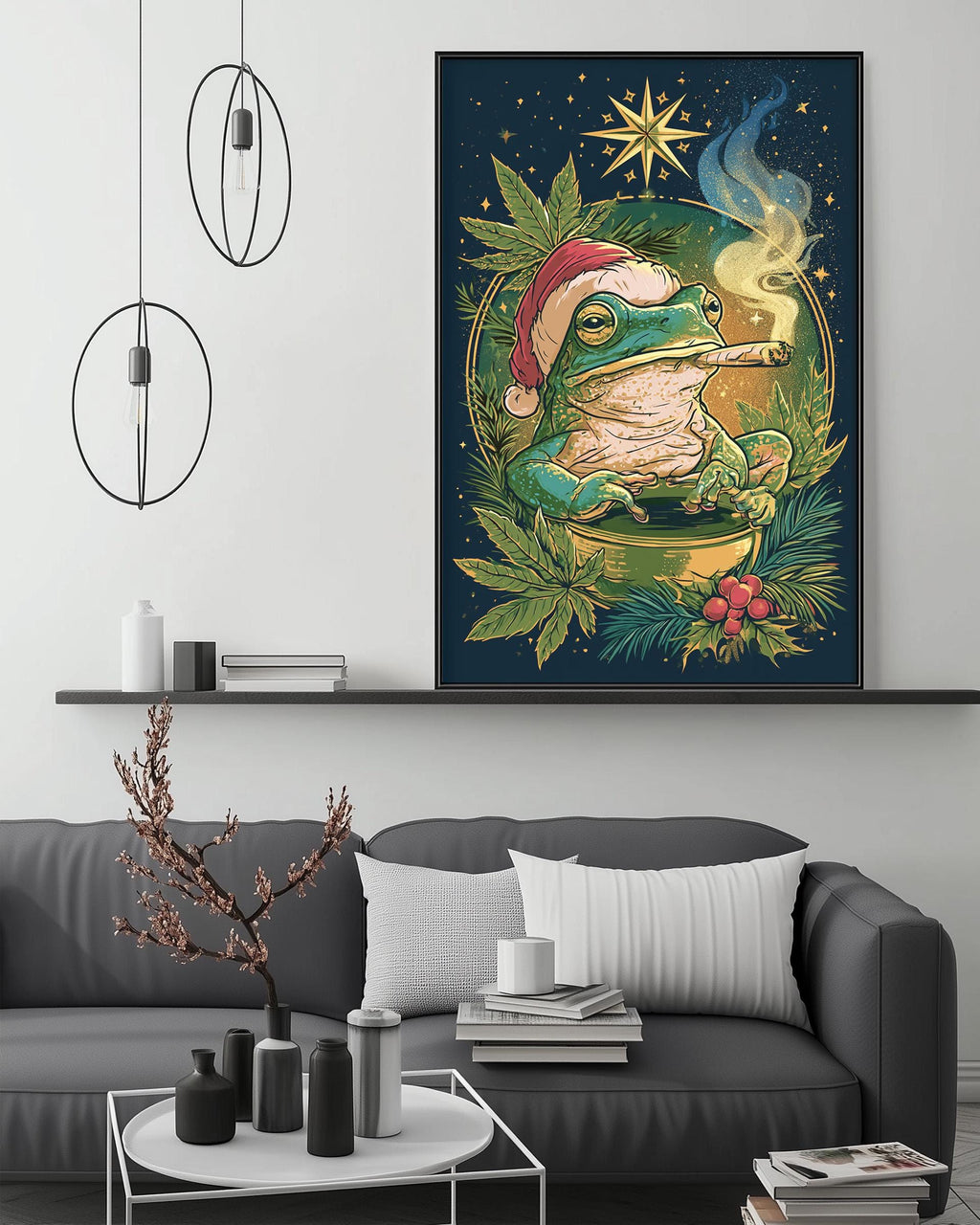 a large, colorful painting of a frog wearing a Santa hat, surrounded by greenery and a starry night sky. The painting is displayed on a wall above a gray couch, which has a coffee table in front of it. The room has a minimalist and modern decor, with pendant lights hanging above the couch and a bookshelf in the background.
