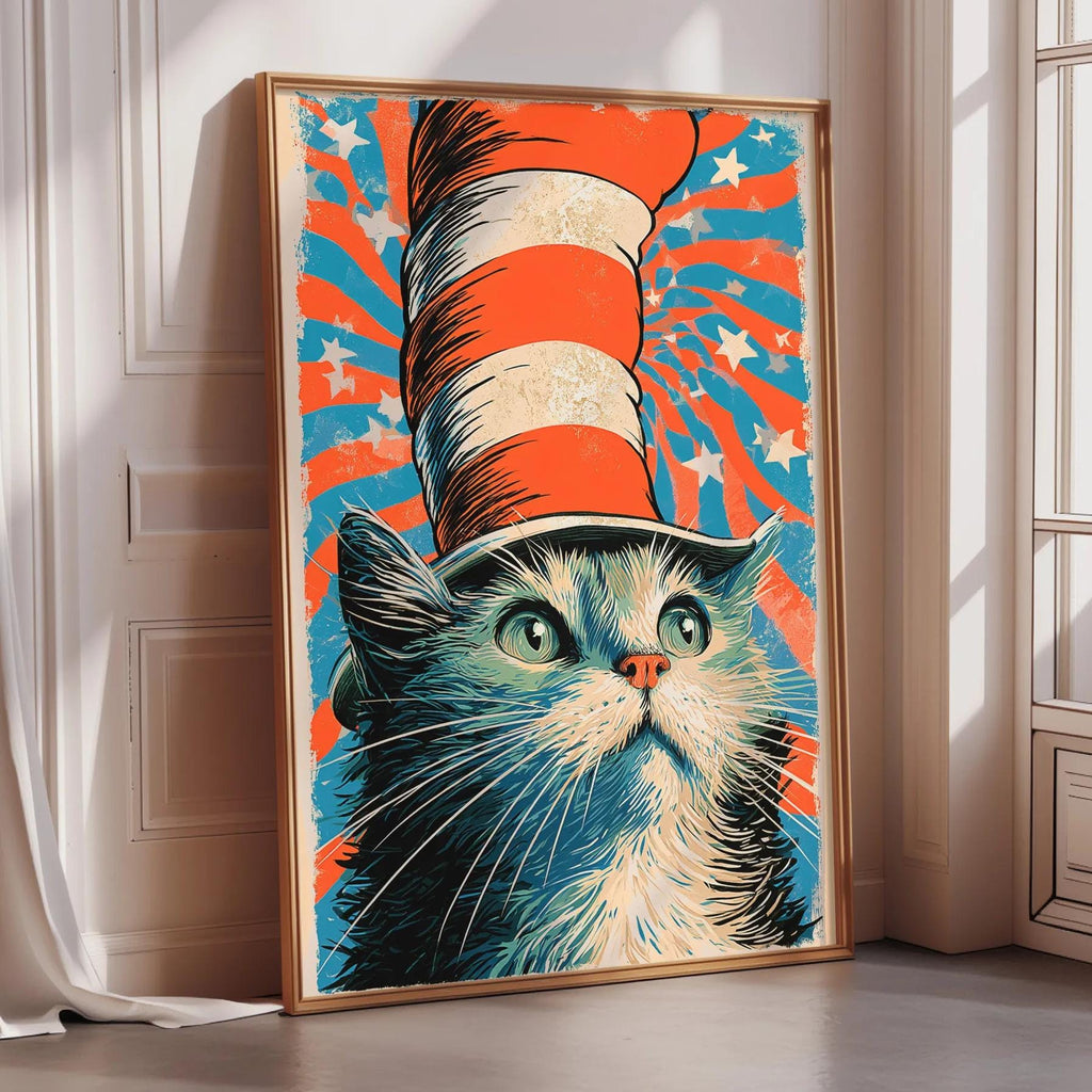 A framed poster of a cat wearing a red, white, and blue striped hat, with a starry background.