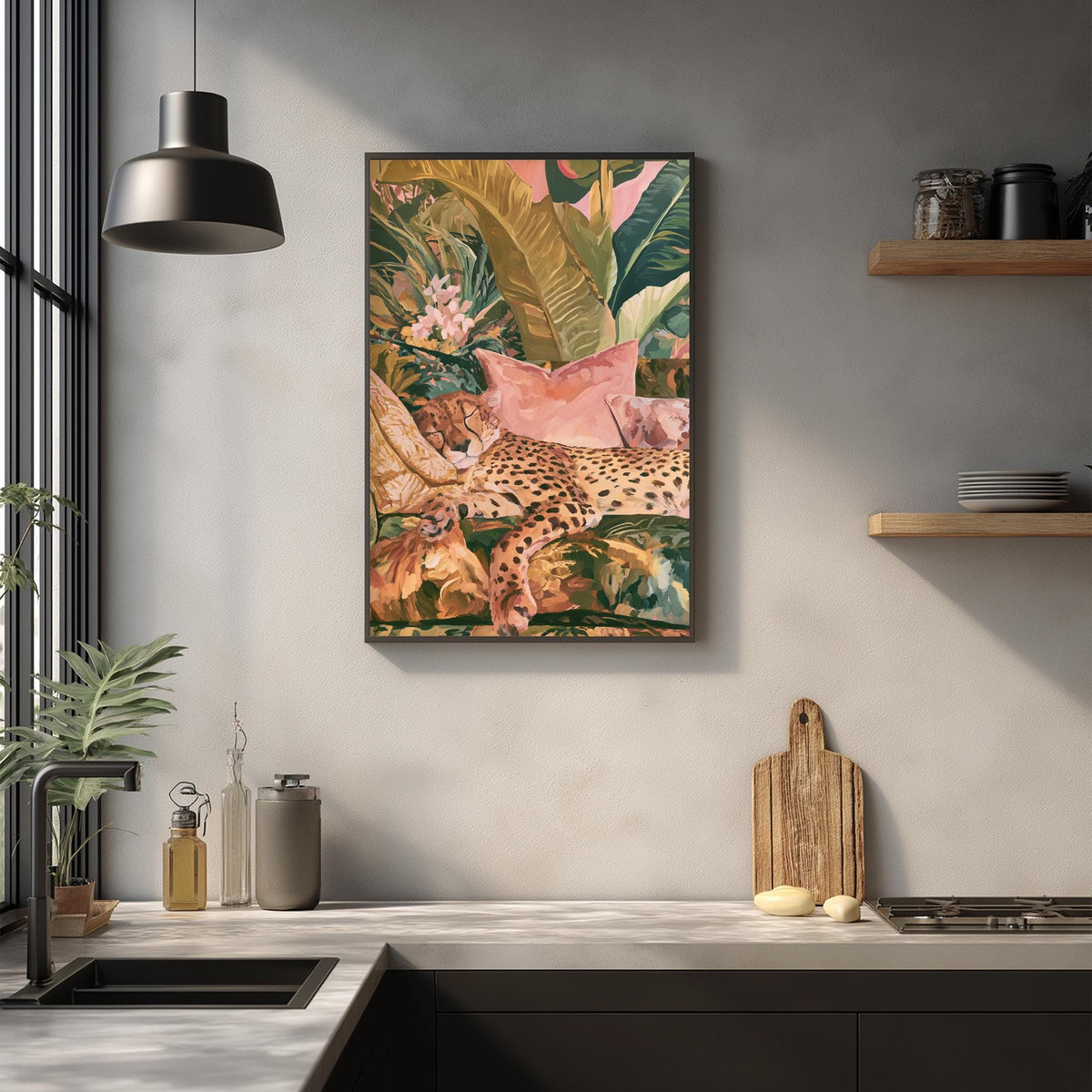 a kitchen counter with a framed painting of a leopard resting on a bed of flowers hanging above it. The painting is surrounded by various kitchen items, such as a cutting board, a bottle, and a vase.