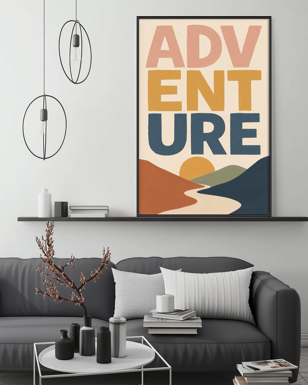 a modern living room with a gray sofa, a coffee table, and a large framed poster with the text "ADVENTURE" displayed on the wall above the sofa.