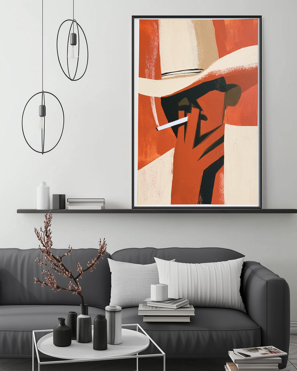 a modern living room with a gray sofa, a coffee table, and a large abstract painting hanging on the wall above the sofa.