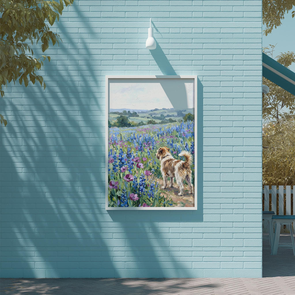 A framed painting of a dog standing in a field of blue flowers is displayed on a light blue brick wall.