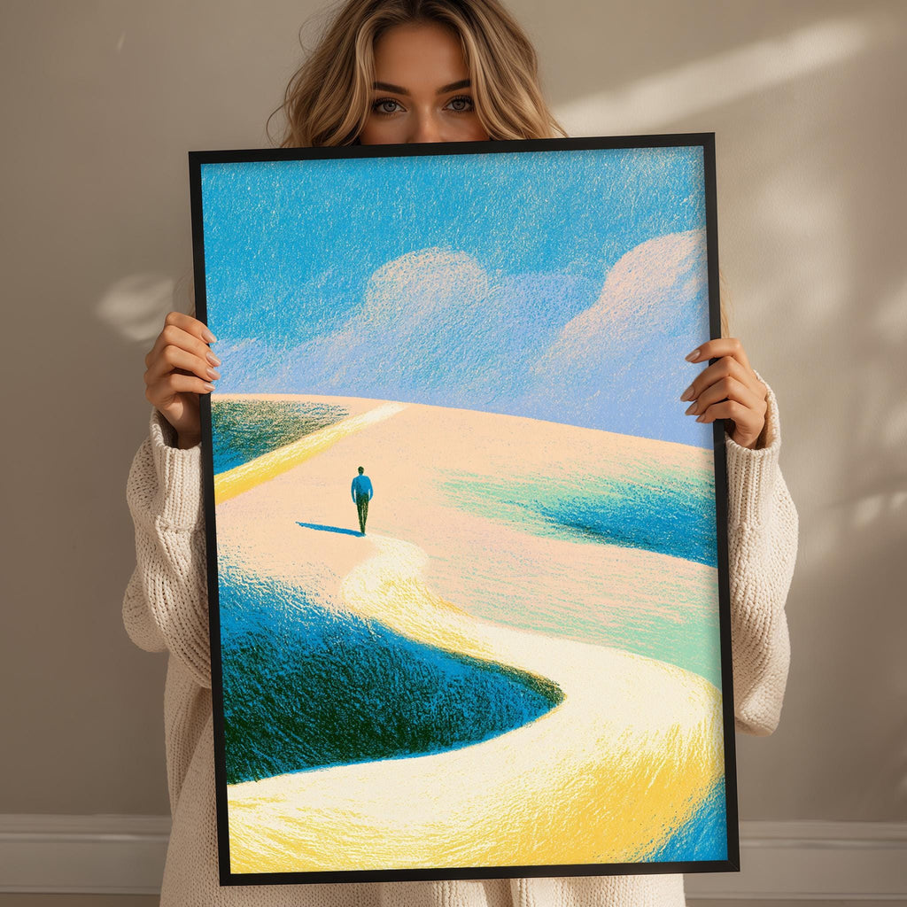 A woman holds up a framed painting depicting a person walking on a winding path through a desert landscape with blue and yellow hues.
