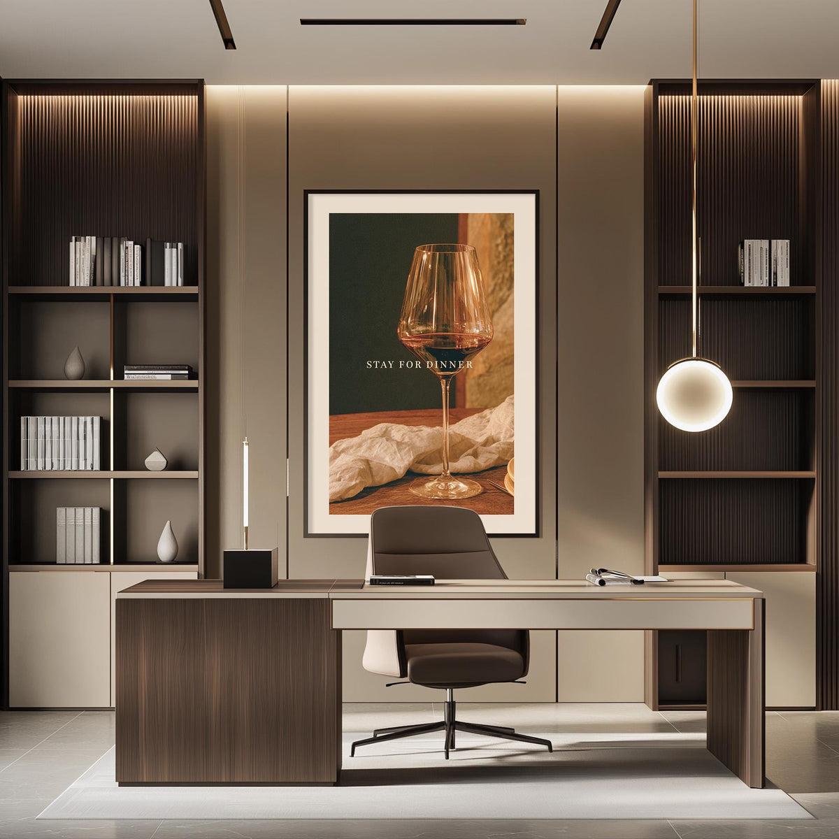 a modern and stylish office space with a large framed poster on the wall that reads "STAY FOR DINNER". The office has a wooden desk, a comfortable chair, and a bookshelf filled with books and decorative items. The overall design and decor create a professional and inviting atmosphere.