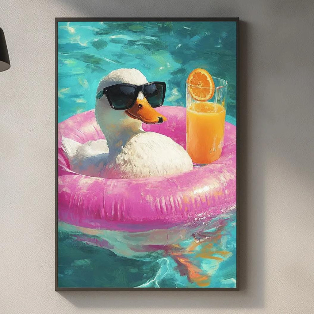 A framed image of a duck wearing sunglasses and holding an orange drink, floating in a pool.