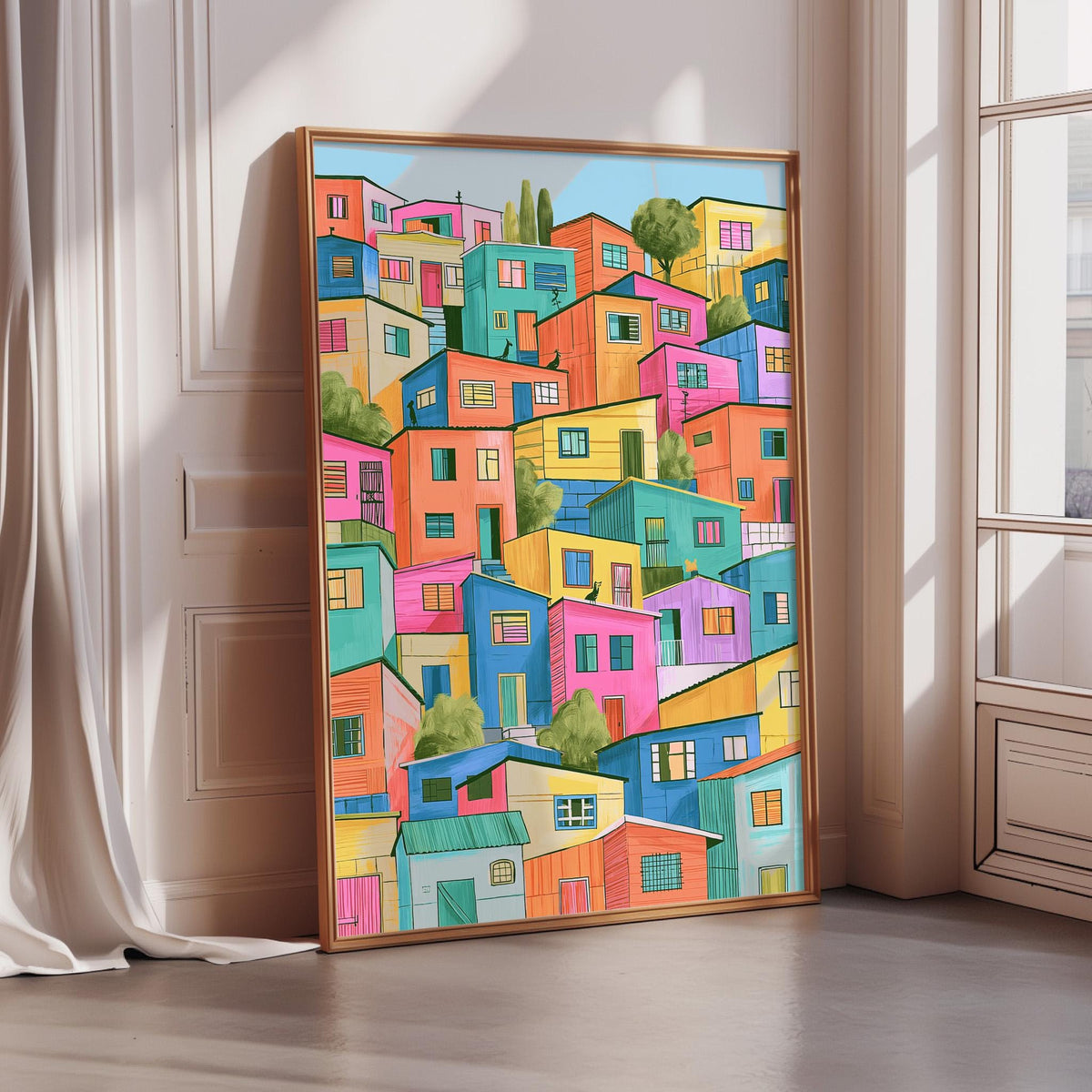 The image is a vibrant and colorful painting of a densely packed cityscape, with buildings in various shades of pink, orange, yellow, green, blue, and purple. The painting is framed and displayed on a wall, creating a striking visual contrast against the white background.