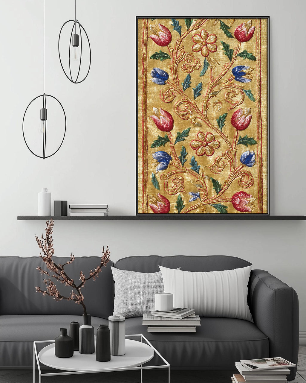 a modern living room with a gray sofa, a coffee table, and a large framed floral print hanging on the wall above the sofa.