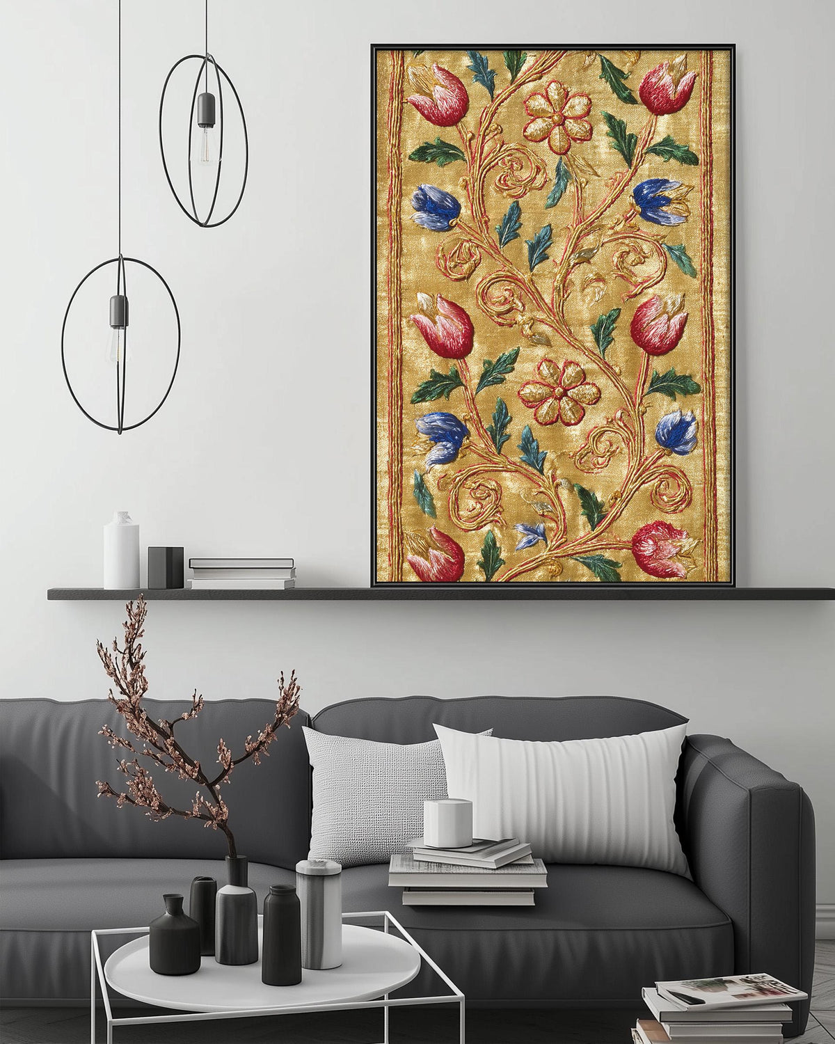a modern living room with a gray sofa, a coffee table, and a large framed floral print hanging on the wall above the sofa.
