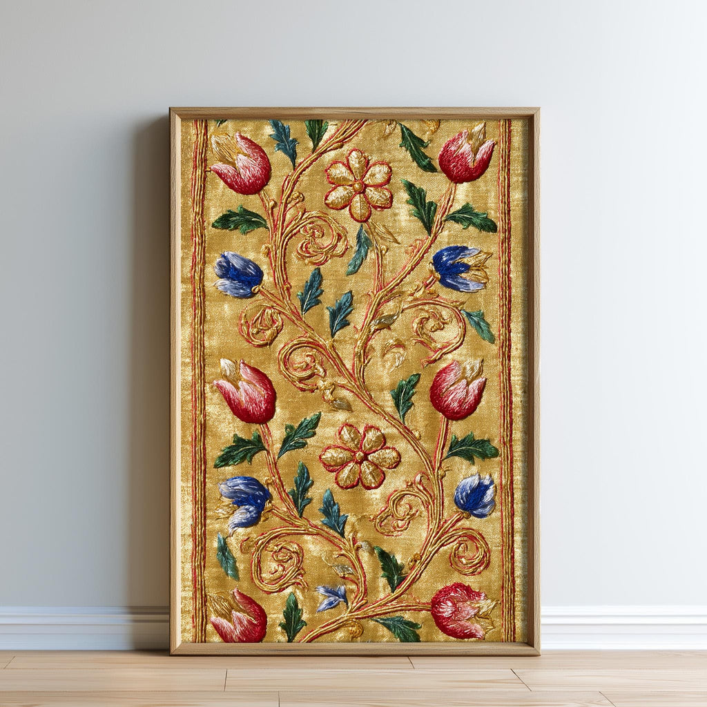 a framed artwork with a gold border and a floral design in red, blue, and green colors.