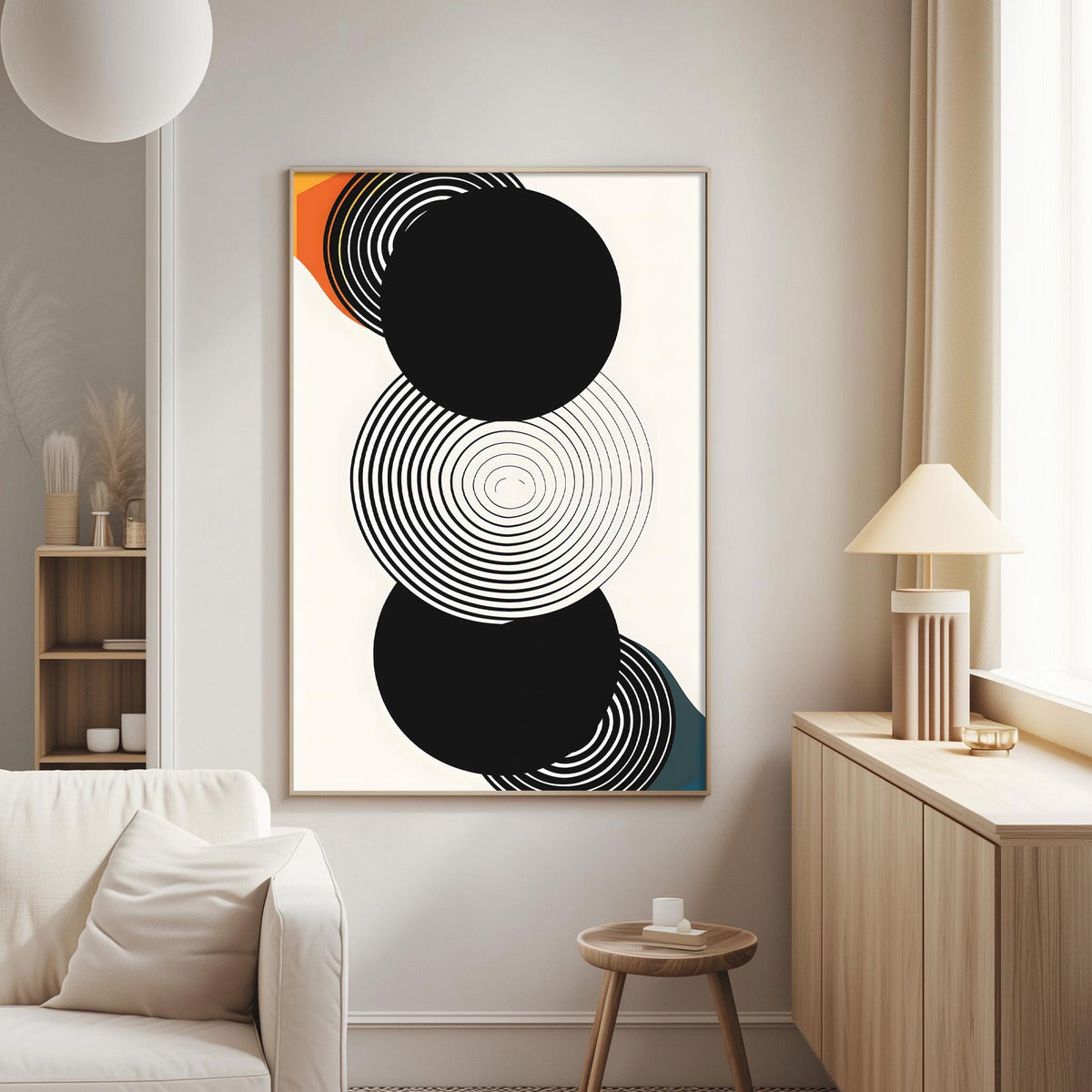 a modern living room with a large abstract painting hanging on the wall. The painting consists of three circles, each with a different color and pattern, creating a visually striking and minimalist design. The room also includes a white sofa, a wooden side table, and a lamp, contributing to the overall contemporary aesthetic.