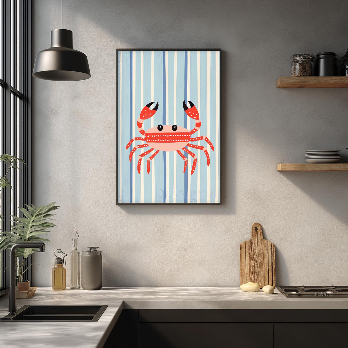 a kitchen counter with a framed picture of a red crab on the wall above it. The kitchen counter also has various items such as a cutting board, a bottle, and a plant.