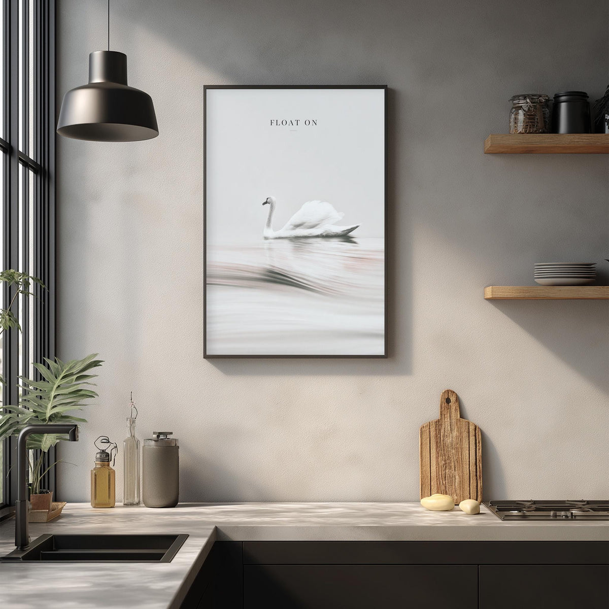 a framed photograph of a swan floating on a lake, hanging on a wall above a kitchen counter with various kitchen items and decor.