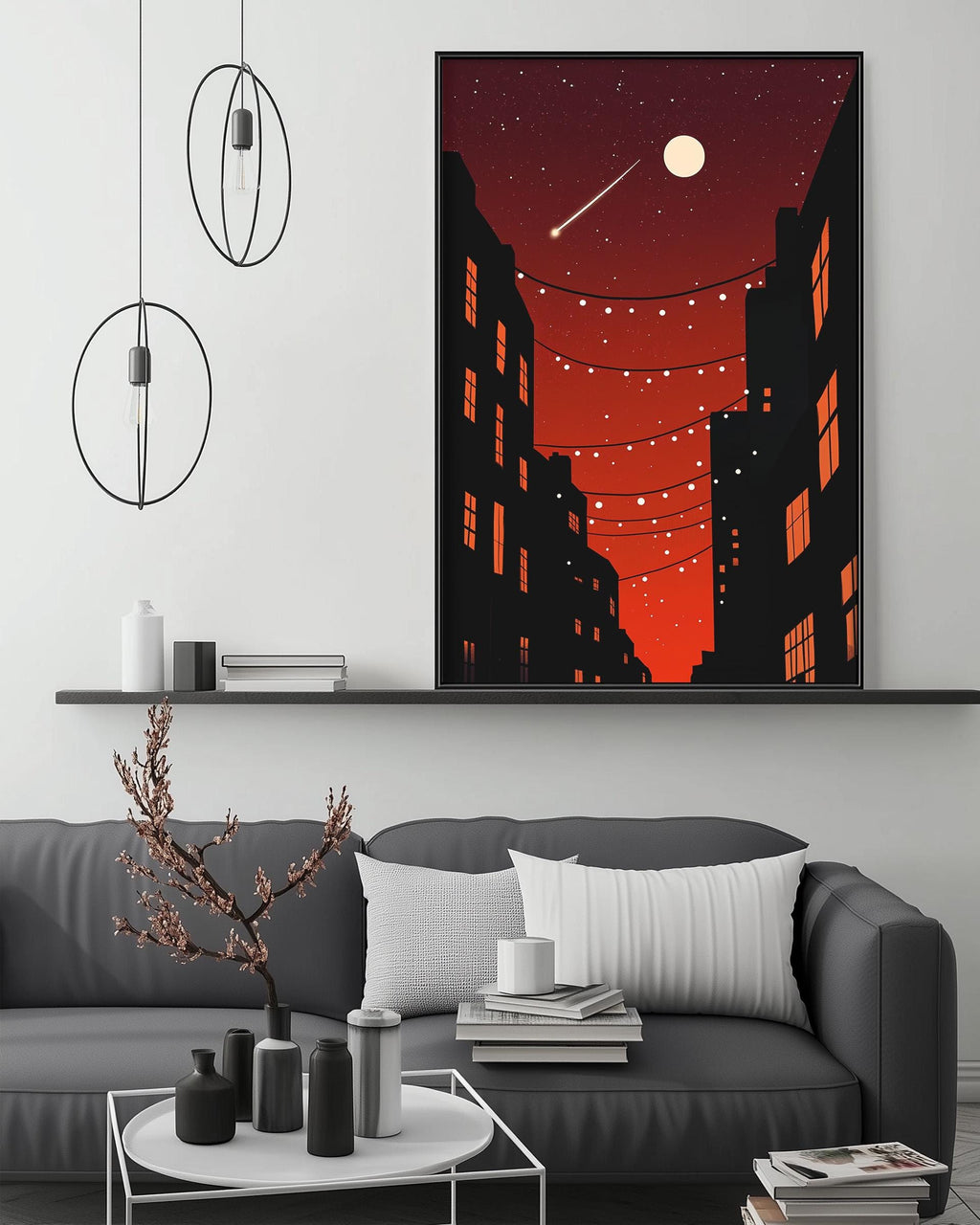 a modern living room with a gray sofa, a coffee table, and a large framed artwork depicting a cityscape at night with a full moon and a shooting star.