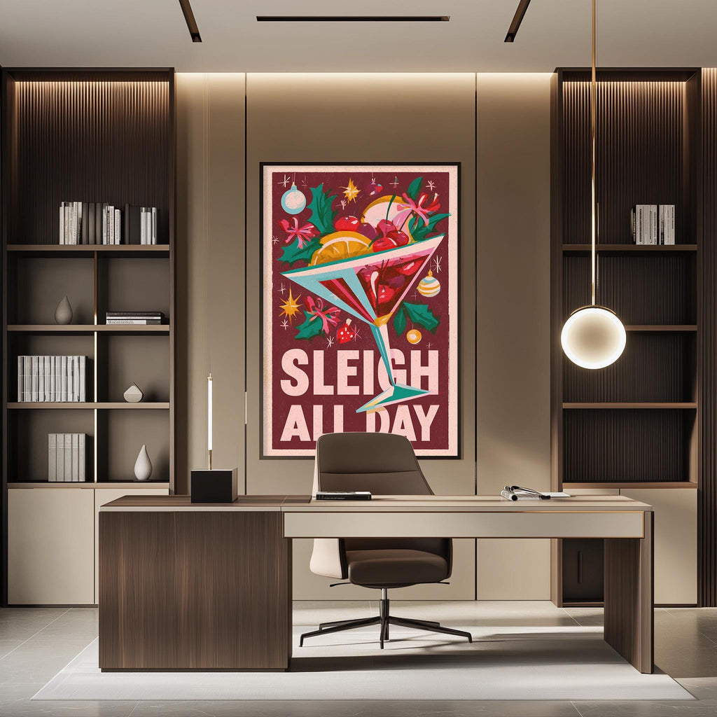 A modern office space with a large framed poster featuring a cocktail glass and the text "SLEIGH ALL DAY" on the wall.