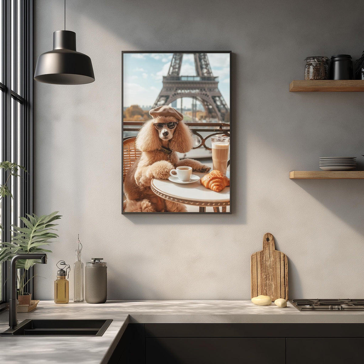 A framed photograph of a poodle dog sitting at a table with a croissant and a cup of coffee, with the Eiffel Tower visible in the background.