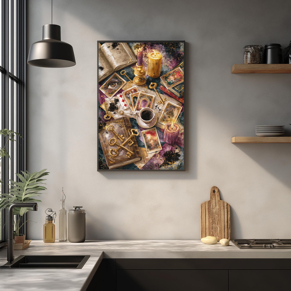 a kitchen counter with various items such as a coffee cup, a wooden cutting board, and a plant. Above the counter, there is a framed artwork depicting a collection of objects, including a book, a candle, and a deck of cards.