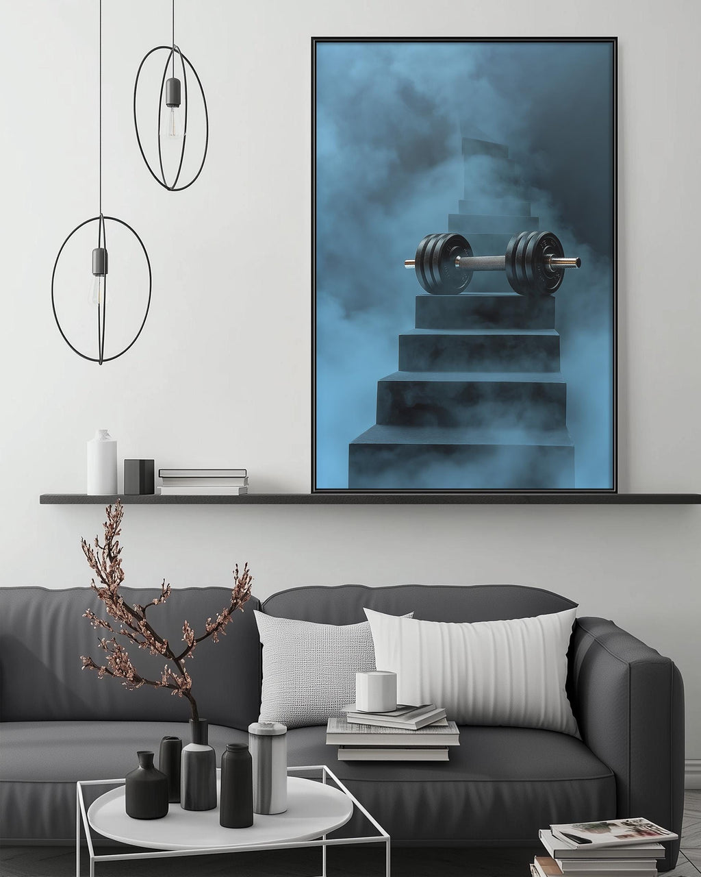 a modern living room with a gray sofa, a coffee table, and a large framed artwork depicting a weight on a staircase.