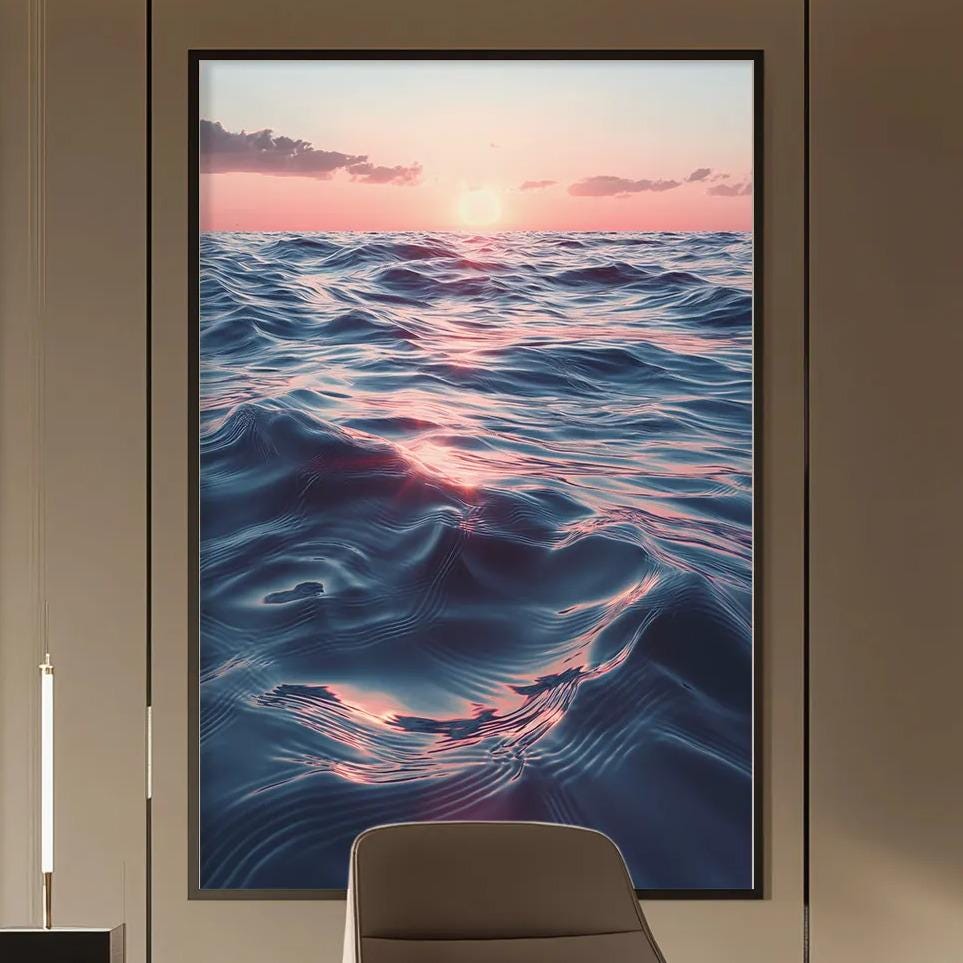 a modern and stylish office space with a large painting of a seascape hanging on the wall. The painting features a sunset over the ocean, creating a calming and serene atmosphere. The office is furnished with a desk, chair, and shelving units, providing a functional and organized workspace.